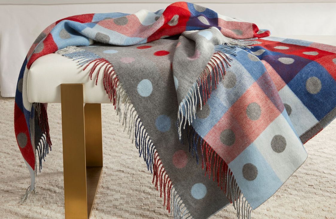 Woollen throw draped over a bench