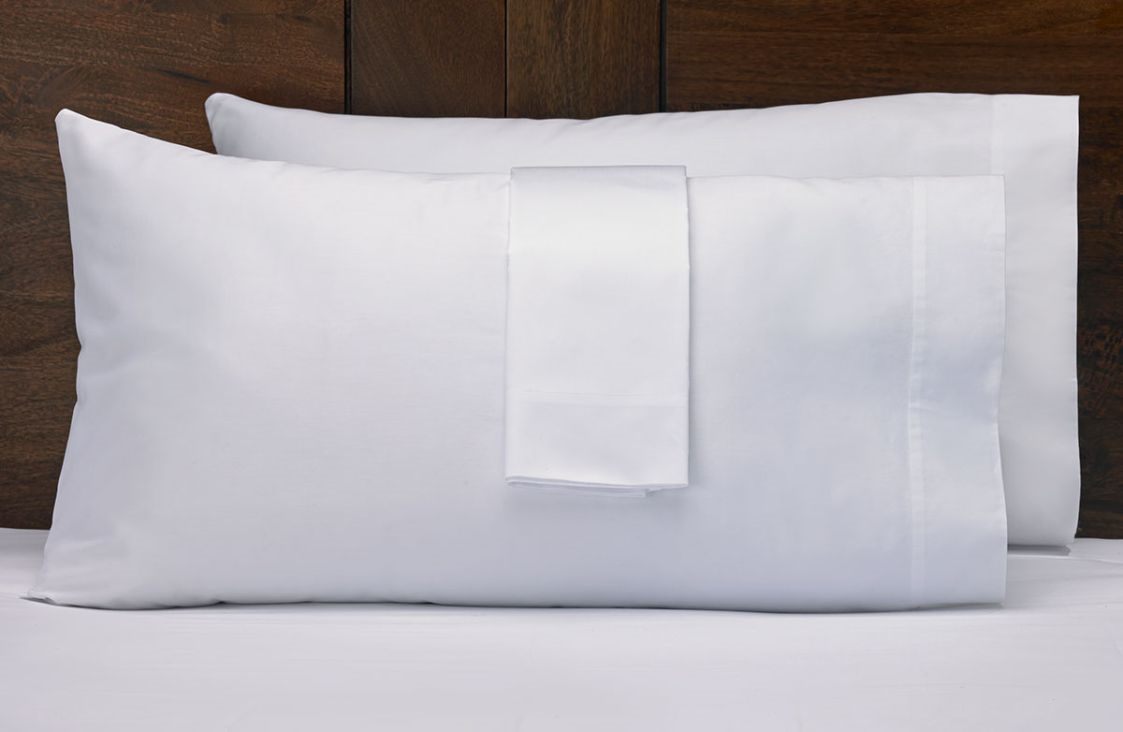 White hotel pillows with protectors
